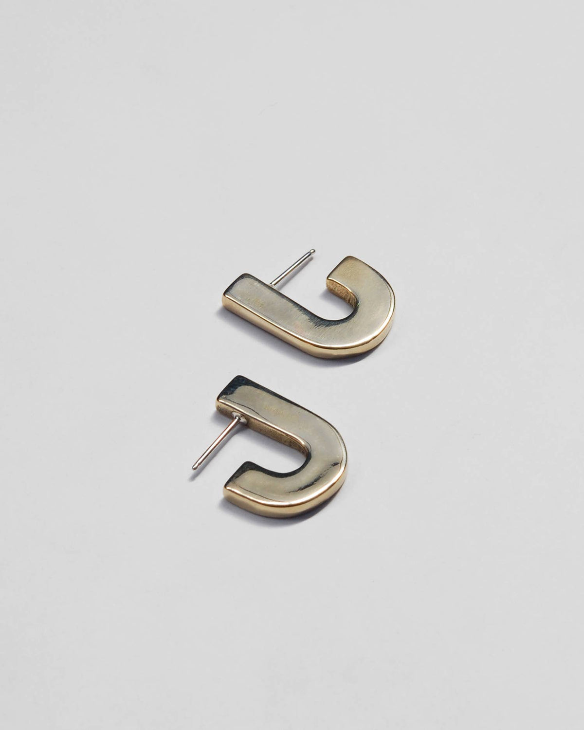 Juxta J Earrings : Brass